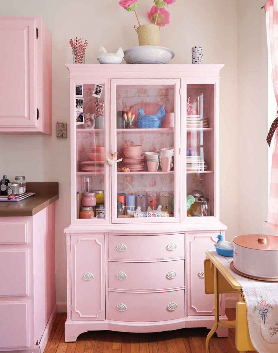 THE POWER OF PAINT. To gain a bit of vintage-y goodness, a thrift store hutch was painted to match the standard cabinetry.