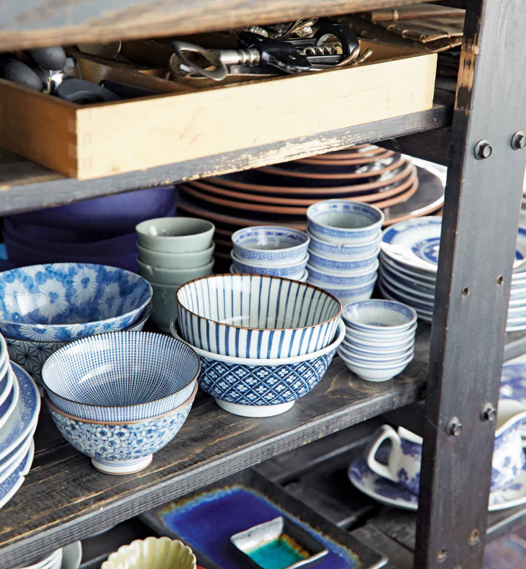 NOWHERE TO HIDE. With every last dish in plain sight, this room shows off its treasures (like this collection of bowls from Pearl River) while making it easier to sort through the eclectic feast.