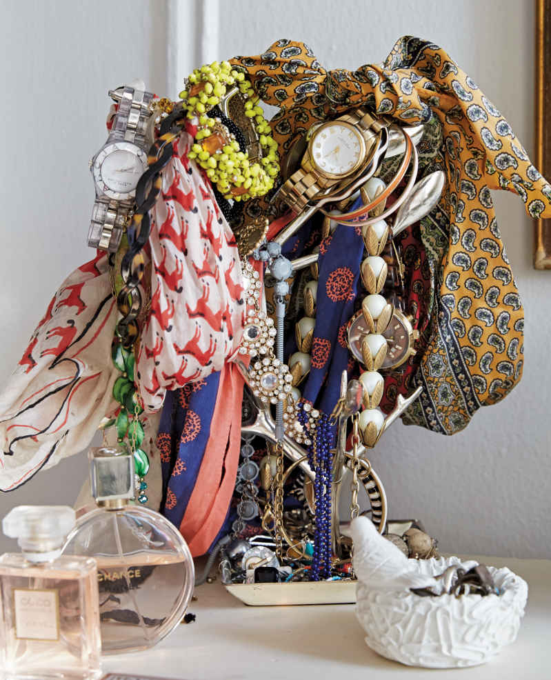JEWELRY JUMBLE. This jewelry tree is buried in personality. Stands like this are an excellent way to stop watches, small accessories, and scarves from becoming a tangled mountain on your dresser.
