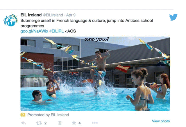 A screenshot image depicting promoted tweet for a language school with a large image and a clearly defined link to the website