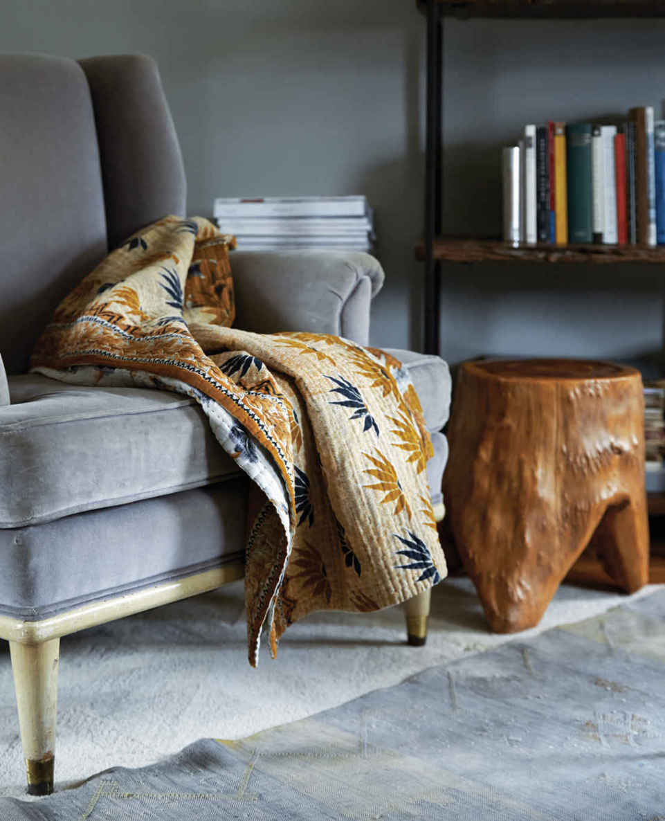 RAW MATERIAL. In very soft, upholstery-heavy environments, adding something raw and rustic, like this carved tree stump, as a counterpoint works really well.